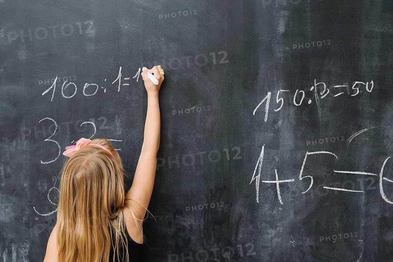 Girl solving math exercise