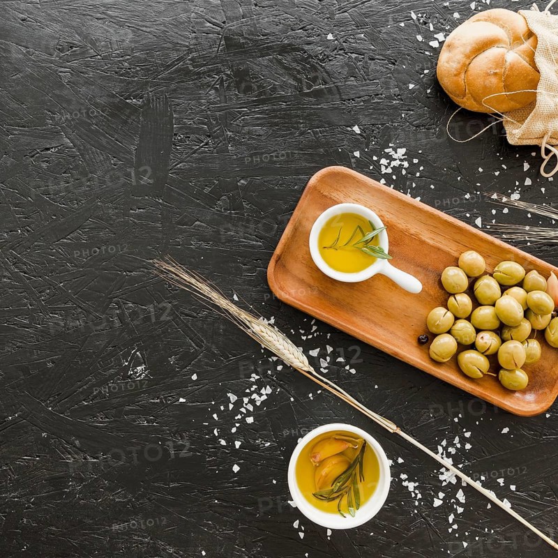 Desktop with olives bread oil