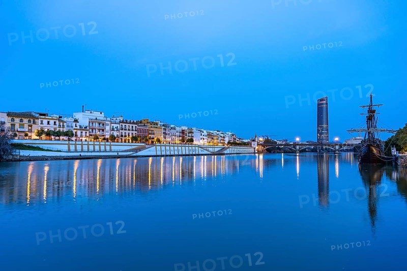 Triana neighbourhood on the banks of the Guadalquivir River at dusk
