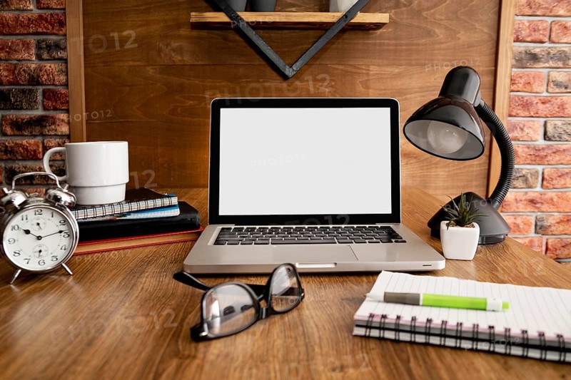 Front view laptop lamp wooden office workspace