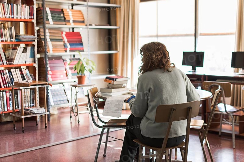 Anonymous woman working library