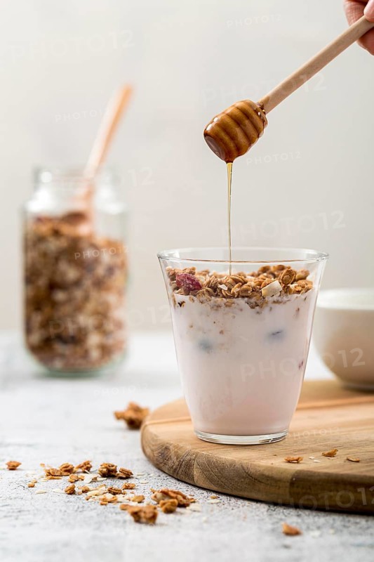 Front view yogurt with granola honey