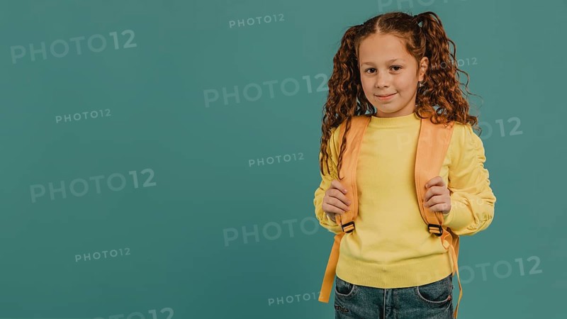 School girl with yellow shirt copy space