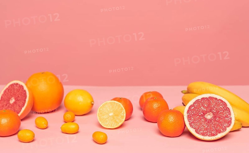 Assortment citruses pink table