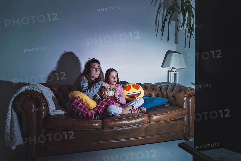 Girls enjoying movie dark room