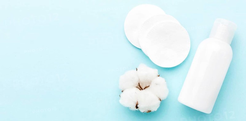 Top view cosmetic cream with cotton pads