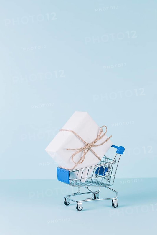 White package shopping cart blue background
