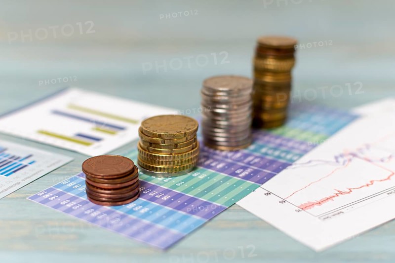 Currency change piles coins