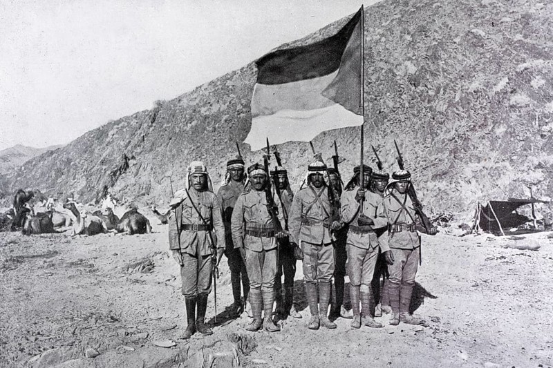 Flag of Hejaz Kingdom carried by soldiers