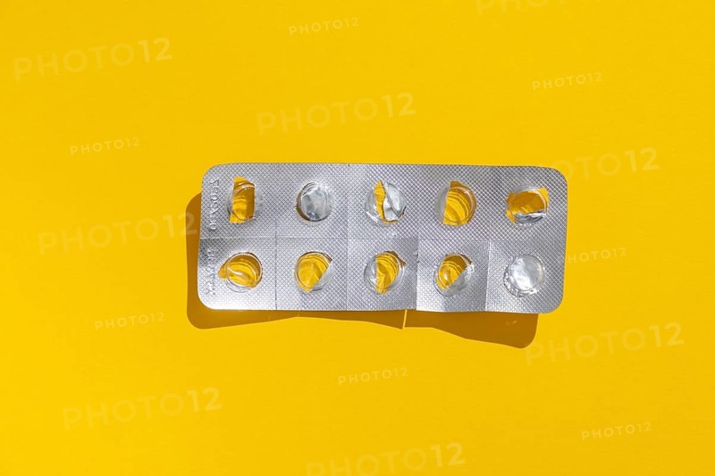 Empty tablet blister pack against a monochrome background
