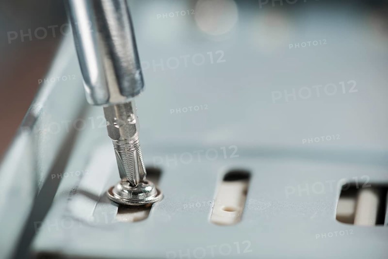 Screwdriver inserted screw