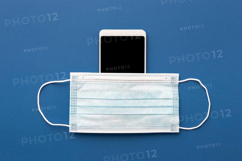 Flat lay medical mask smartphone