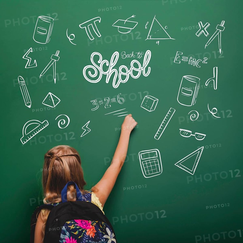 Medium shot girl writing green board