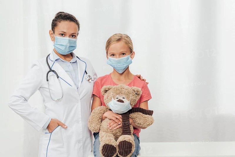 Medium shot doctor kid bear