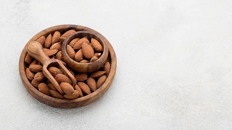 Organic almond nuts bowl copy space