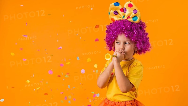 Girl with confetti clown costume