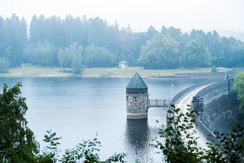 Dam wall of the Dreilaegerbach dam near Roetgen in the fog
