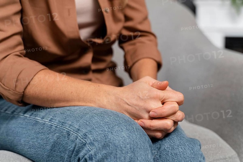 Woman holding hands together