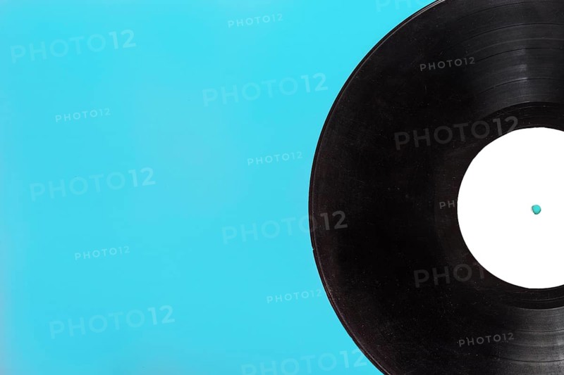 Single circular vinyl record blue background
