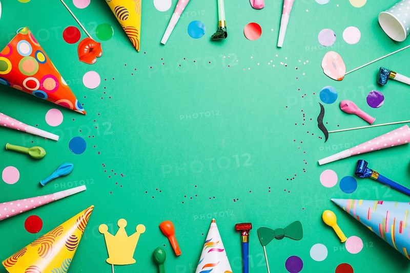 Colorful birthday frame multicolor party items green background