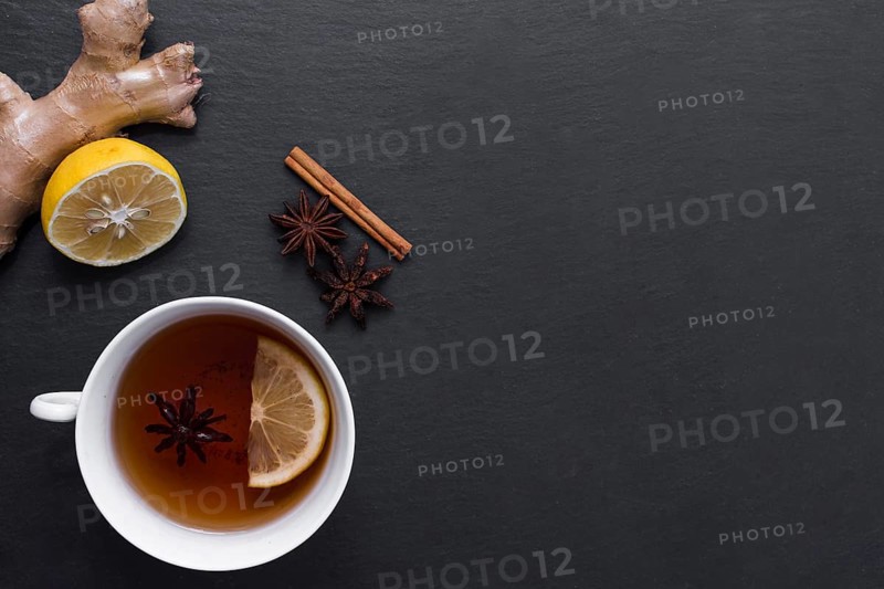 Lemon tea with ginger cinnamon beside