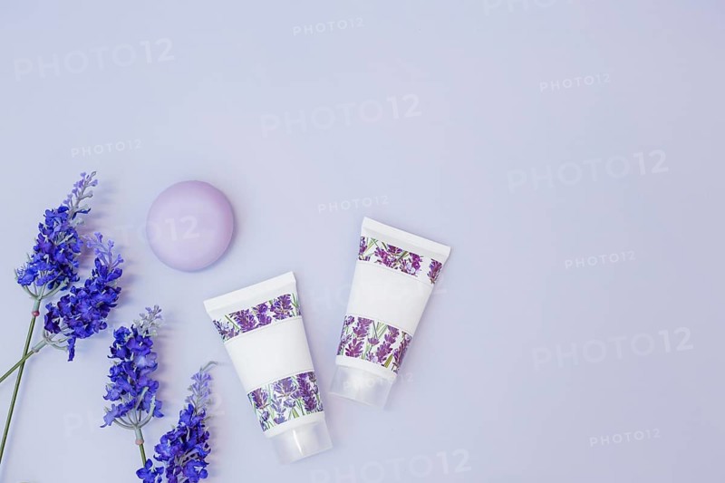Fake lavender flower soap moisturizing cream colored background
