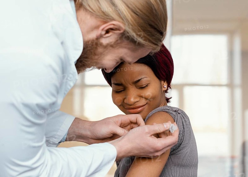 Close up woman getting vaccinated
