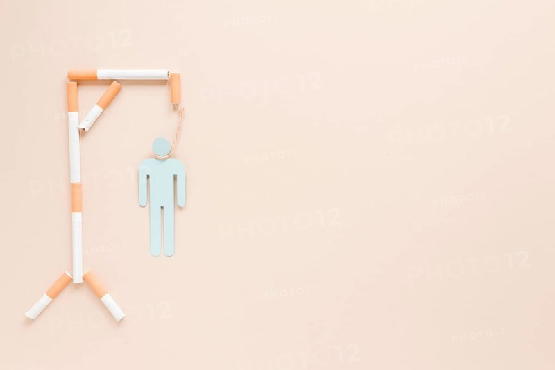 Top view hanging man made by cigarettes