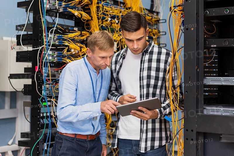 Network engineers with tablet medium shot