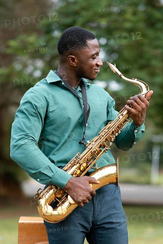 Young man playing instrument international jazz day 1