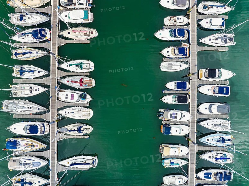Top Down view over Boats and Yachts in Brixham Marina from a drone