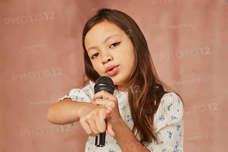 Little girl learning how sing home