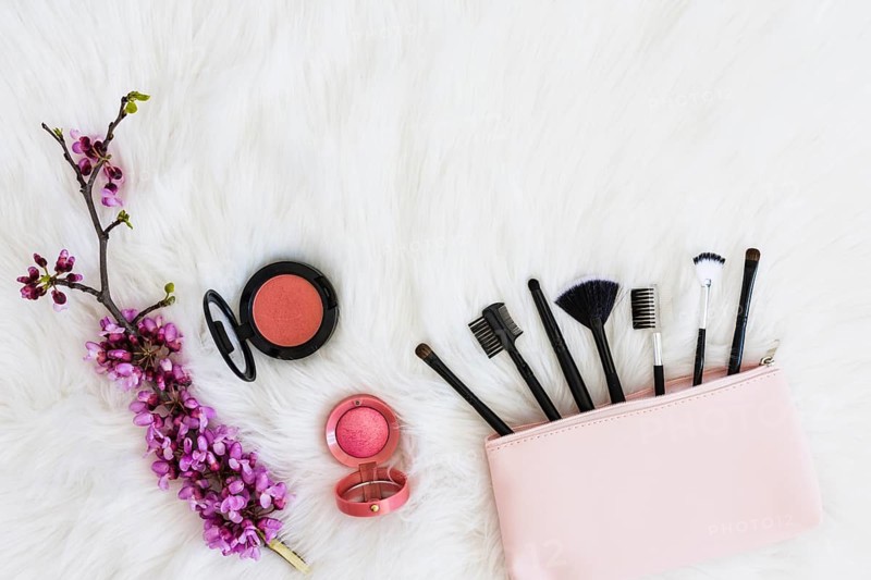 Many makeup brushes out pink bag flower twig compact face powder soft white fur