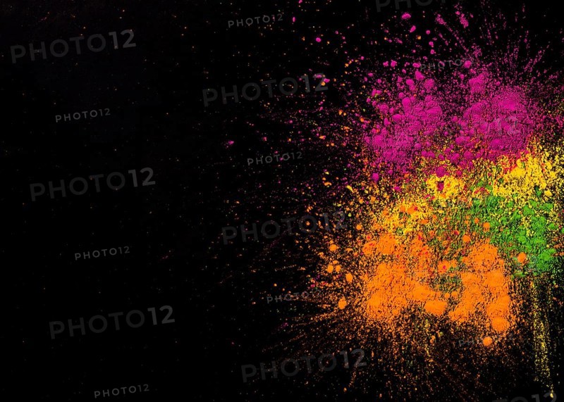 Explosion holi colors dark background