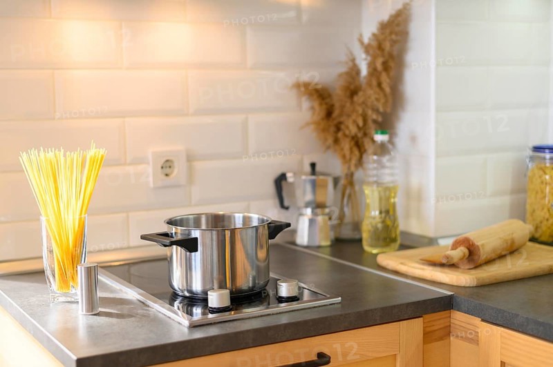 Modern apartment kitchen with pasta glass