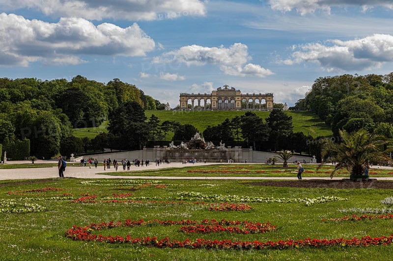 Schoenbrunn Palace Park with flower meadow Neptune Fountain and Gloriette