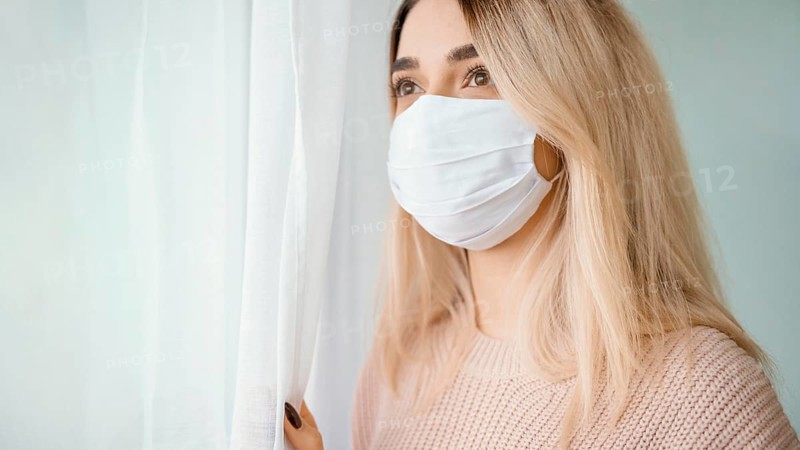 Stay indoors woman wearing white medical mask