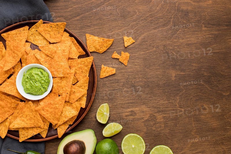 Top view tasty nachos with fresh guacamole