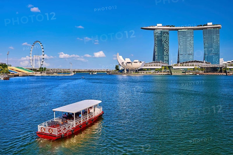 Tourist cruise boat approaching Marina Bay Sands