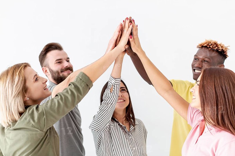 Group young friends high five air