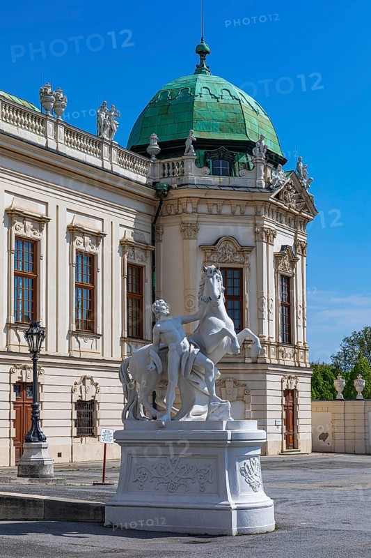 Stone horse and rider figure in front of the Belvedere Upper Baroque Palace