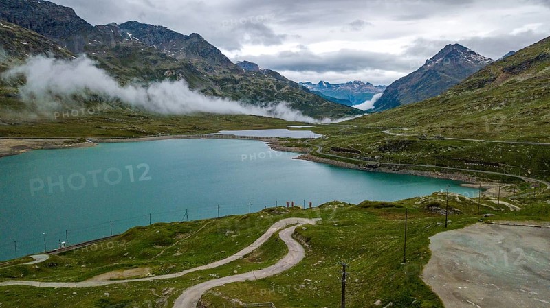 Aerial view bird's eye view of mountain lake at mountain pass alpine mountain road pass road Bernina Pass Bernina Pass