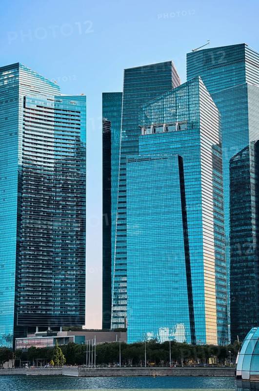 Group of buildings in CBD or Central Business District buildings over Marina Bay waters in day light