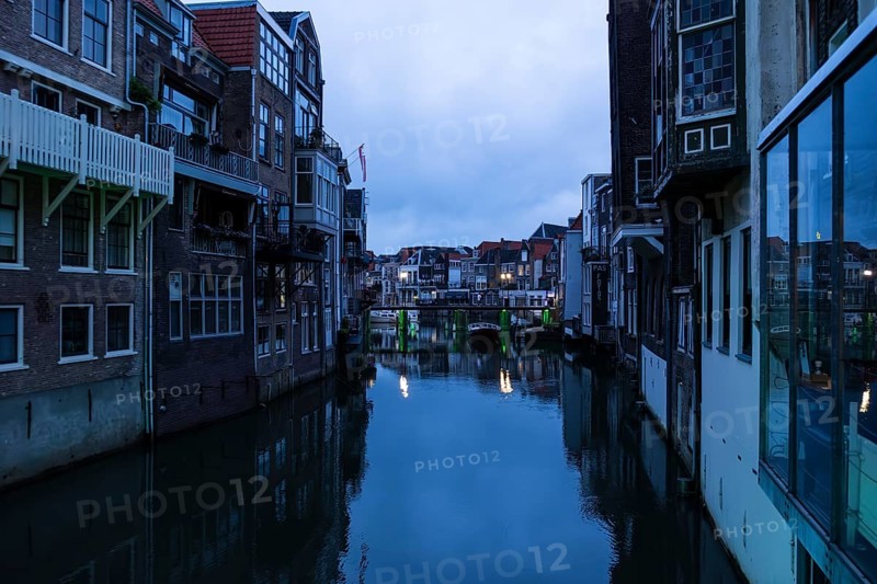 Gracht with old houses in the blue hour in Dordrecht