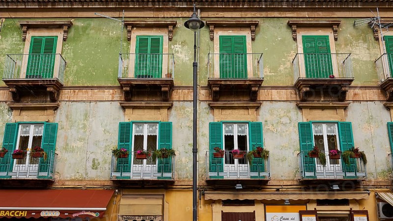 Pale green house front