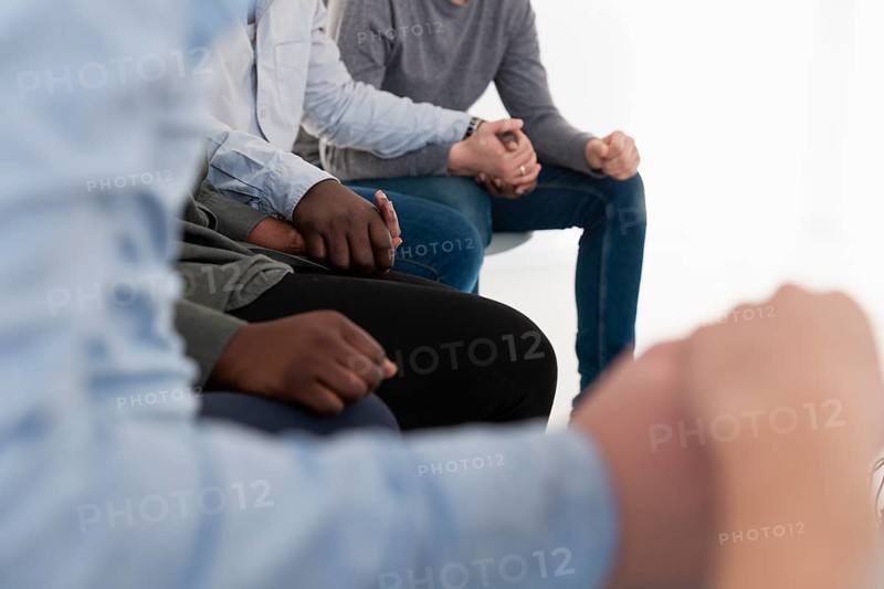 Rehab patients hands holding together