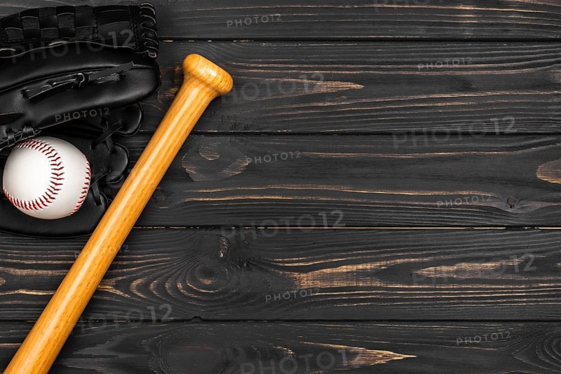 Flat lay baseball bat with glove ball
