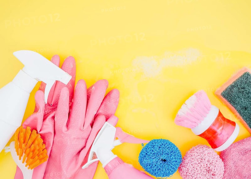Spray bottle brush sponge pink gloves yellow backdrop