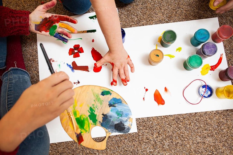 High angle child woman painting