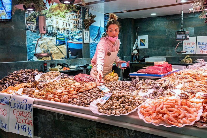 Saleswoman at the seafood stall